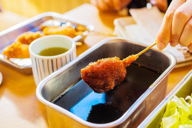 Absolute Osaka Food Tour - Stop 2: Dotonbori District, learning how to avoid the worst queues