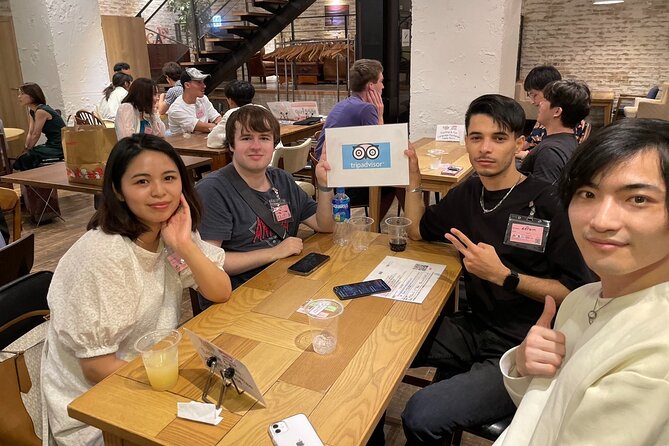 Easy Japanese Speaking Experience and Meet Locals in Shibuya - Jinnan Cafe check-in, seating cards, and the drink that does the heavy lifting