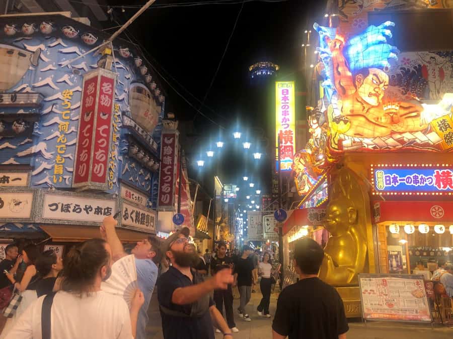 Hungry Osaka Street Food Tour: 15 Dishes & 3 Drinks - Yakitori and Izakaya-Style Stops: Charcoal Smoke and Small, Smart Pairings