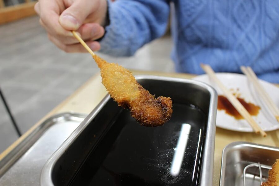 Osaka: 2-Hour Local Street Food Tour – Dotonbori & Namba - Back Through Dotonbori for Local Snacks and Another Quick Photo Moment