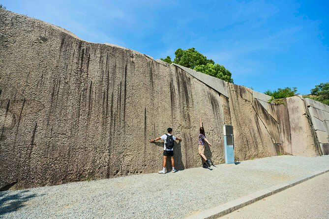 Osaka Castle Walking Tour and Castle Tower Admission - Osaka Castle main keep: defenses, relics, and the biggest stone