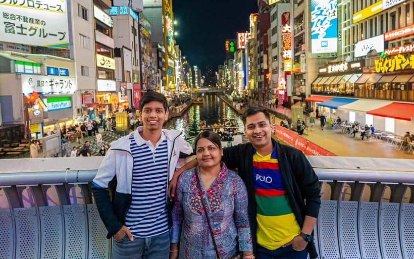 Osaka: Private Vibrant Nighttime Photoshoot (Dotonbori) - Ebisubashi Bridge to the Glico Sign, your Osaka “main character” sequence