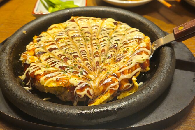 Osaka: Shinsekai Food Tour - 13 Dishes at 5 Local Eateries - Stop 2: Shinsekai district and Tsutenkaku energy