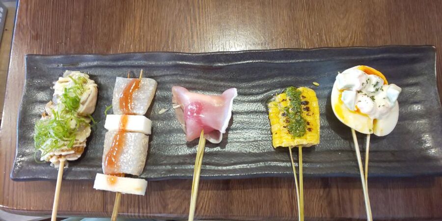 Osaka: Shinsekai Food Tour with 13-15 Dishes at 5 Eateries - The final feast: tonpeiyaki, karaage, edamame, and more