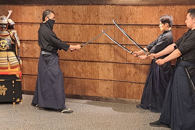Samurai Sword Experience (Family Friendly)at SAMURAI MUSEUM KYOTO - Donning samurai armor and posing in themed backgrounds