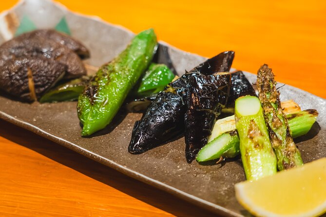Tokyo Ginza Authentic Food Tour (Izakaya Hopping by local guide) - Ginza Mitsukoshi photo moment: a quick landmark break that doesn’t steal time