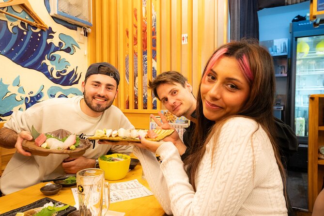Tokyo: Shibuya Authentic Food Tour & Local Delights - Shibuya at night, four meals, and a guide who talks through the bites