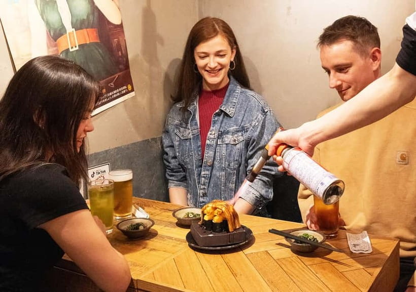 Tokyo: Shinjuku Bar Hopping & Night Walking Tour - Omoide Yokocho: red lanterns, tight tables, and the sushi moment