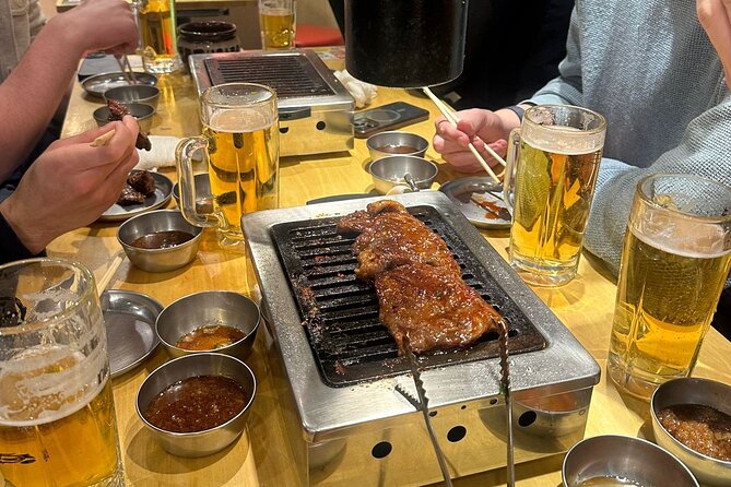 Tokyo: Shinjuku Bar Hopping & Night Walking Tour - Omoide Yokocho: comfort food energy in a narrow, smoky alley world