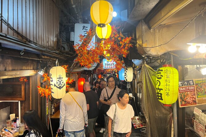Tokyo: Shinjuku Food Tour (13 Dishes at 4 Local Eateries) - Stop 3: Shinjuku Golden Gai and Golden Gas, Post-War Alleys of Tiny Bars