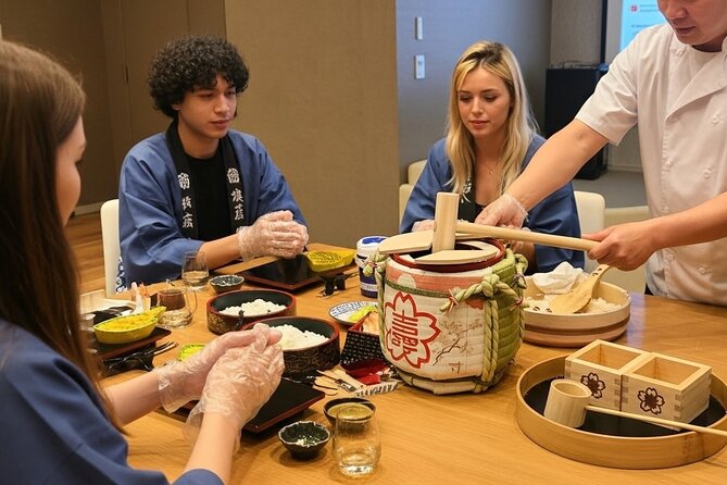 Tokyo Sushi Making Class : Sake Ceremony & Matcha Experience - Kagami-biraki: the sake barrel opening and the group toast